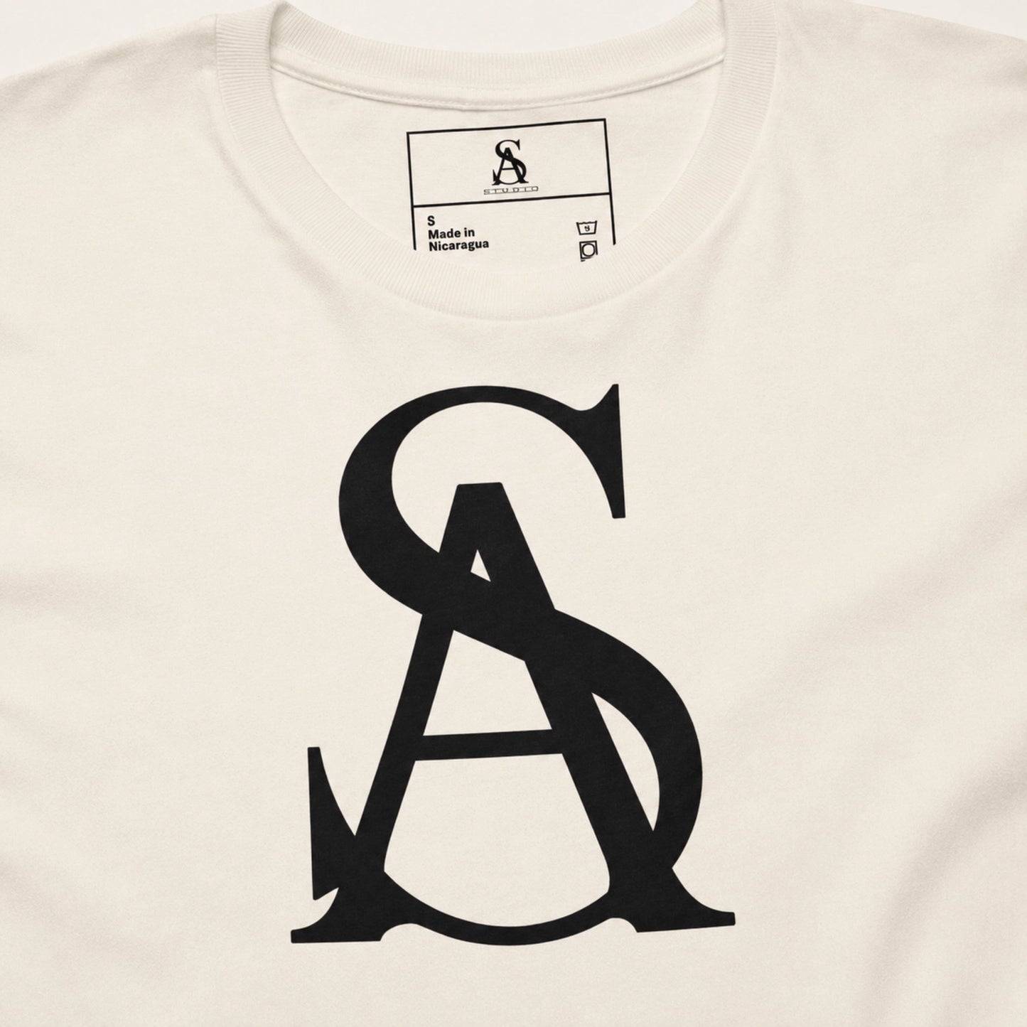 White t-shirt with black logo and brand label on a white background