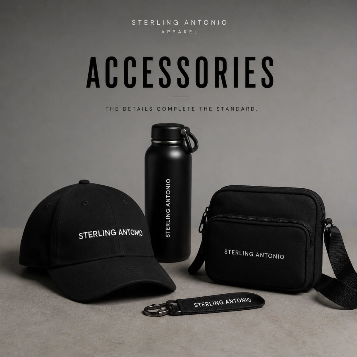 Premium Sterling Antonio accessories collection featuring a black logo cap, crossbody bag, insulated water bottle, and keychain in a modern studio, showcasing luxury everyday essentials.