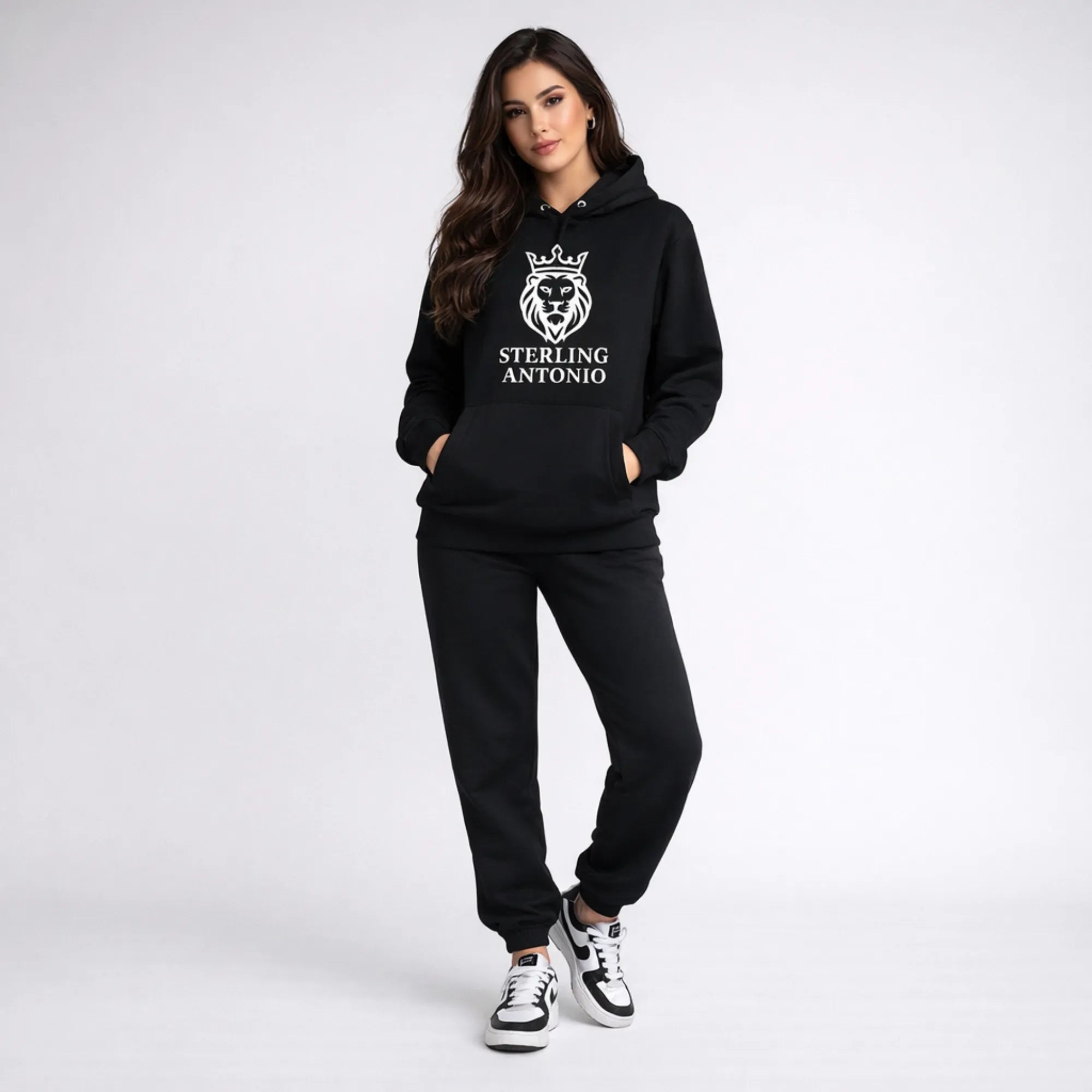 Person wearing a black hoodie and pants with 'Sterling Antonio' logo on a white background