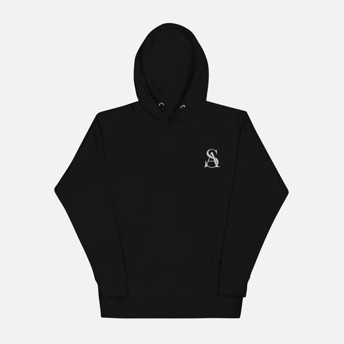 Black hoodie with a small logo on the chest against a light gray background