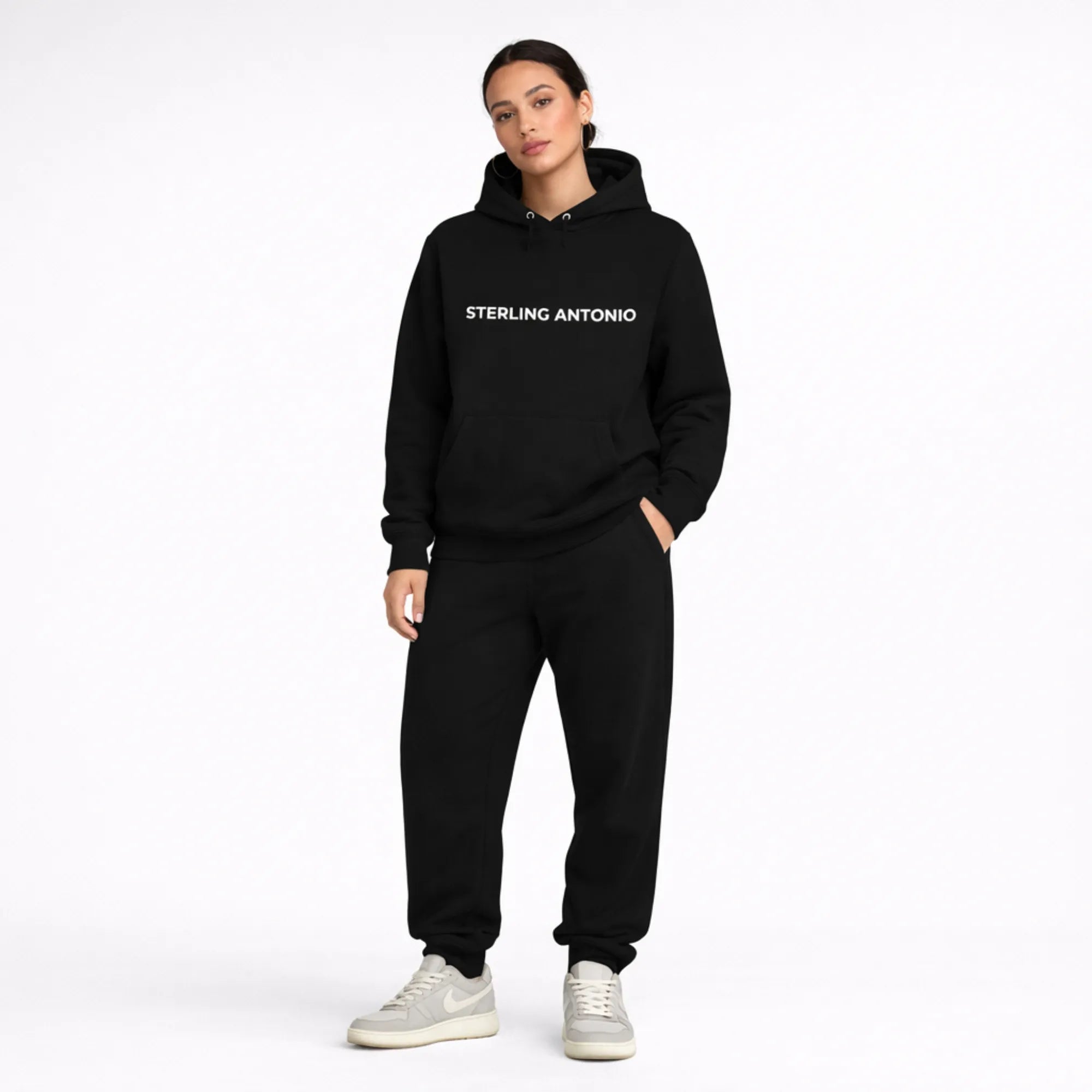 Person wearing a black hoodie with 'STERLING ANTONIO' text on a white background