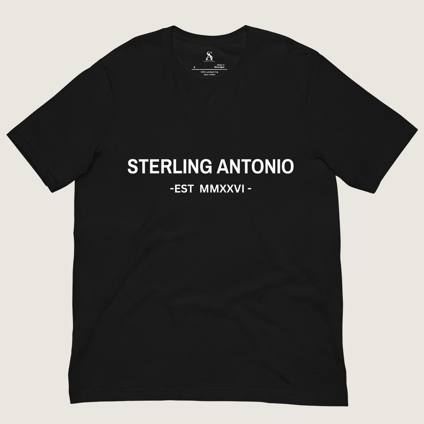 Black t-shirt with 'STERLING ANTONIO EST MMXXVI' text on a beige background