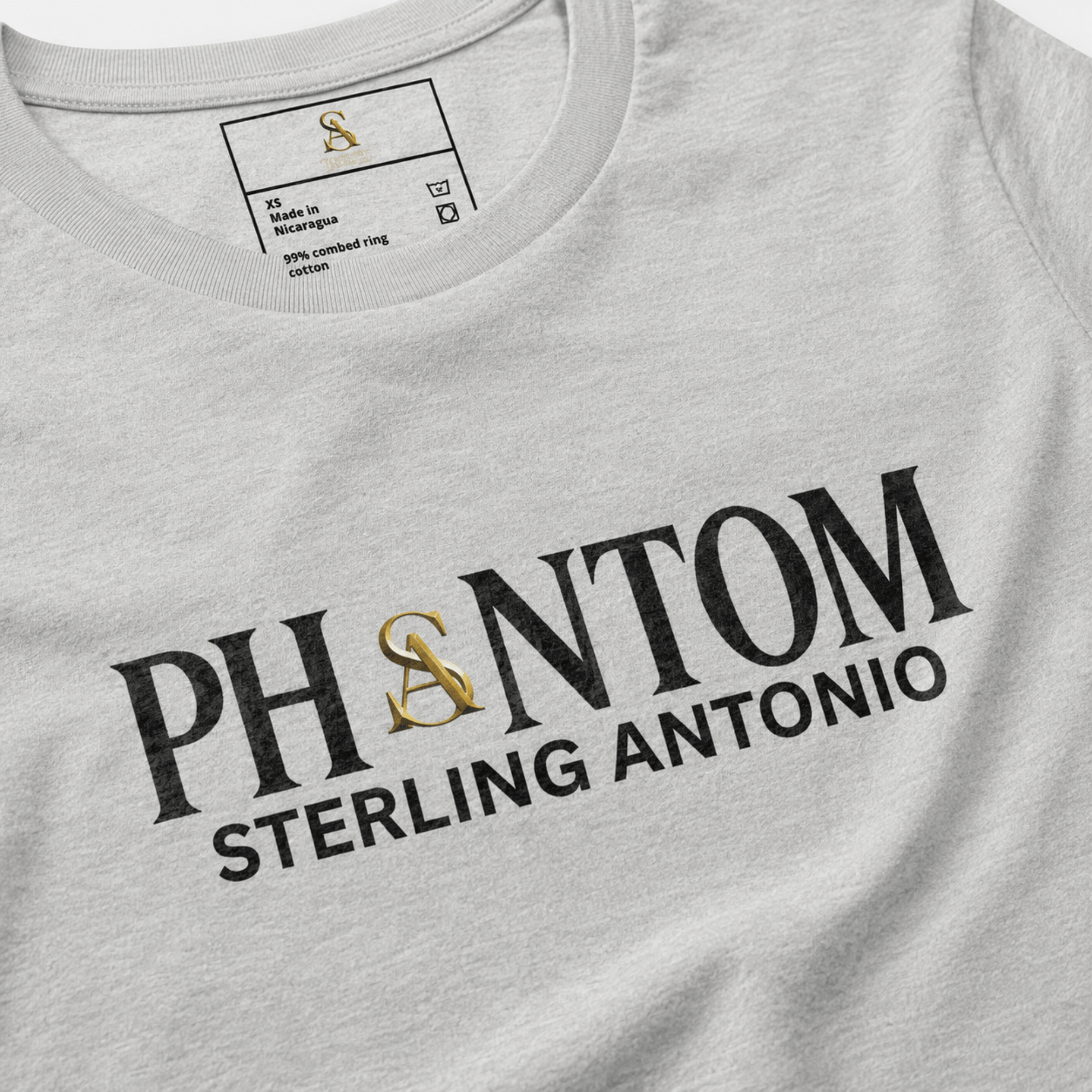 Close-up of a heather grey Sterling Antonio cotton jersey t-shirt featuring bold Phantom typography with gold SA logo.