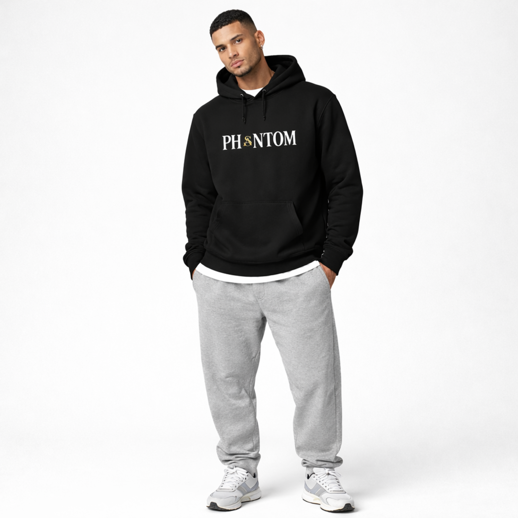 Man wearing a black hoodie with 'PHANTOM' logo and gray sweatpants on a white background