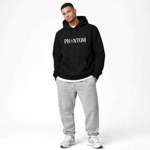Man wearing a black hoodie with 'PHANTOM' logo and gray sweatpants on a white background