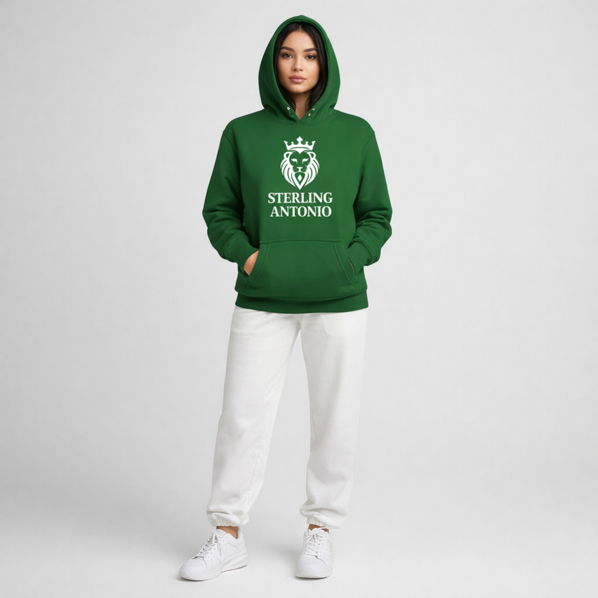 Person waring green hoodie with white sweapants nad STERLING ANTONIO logo