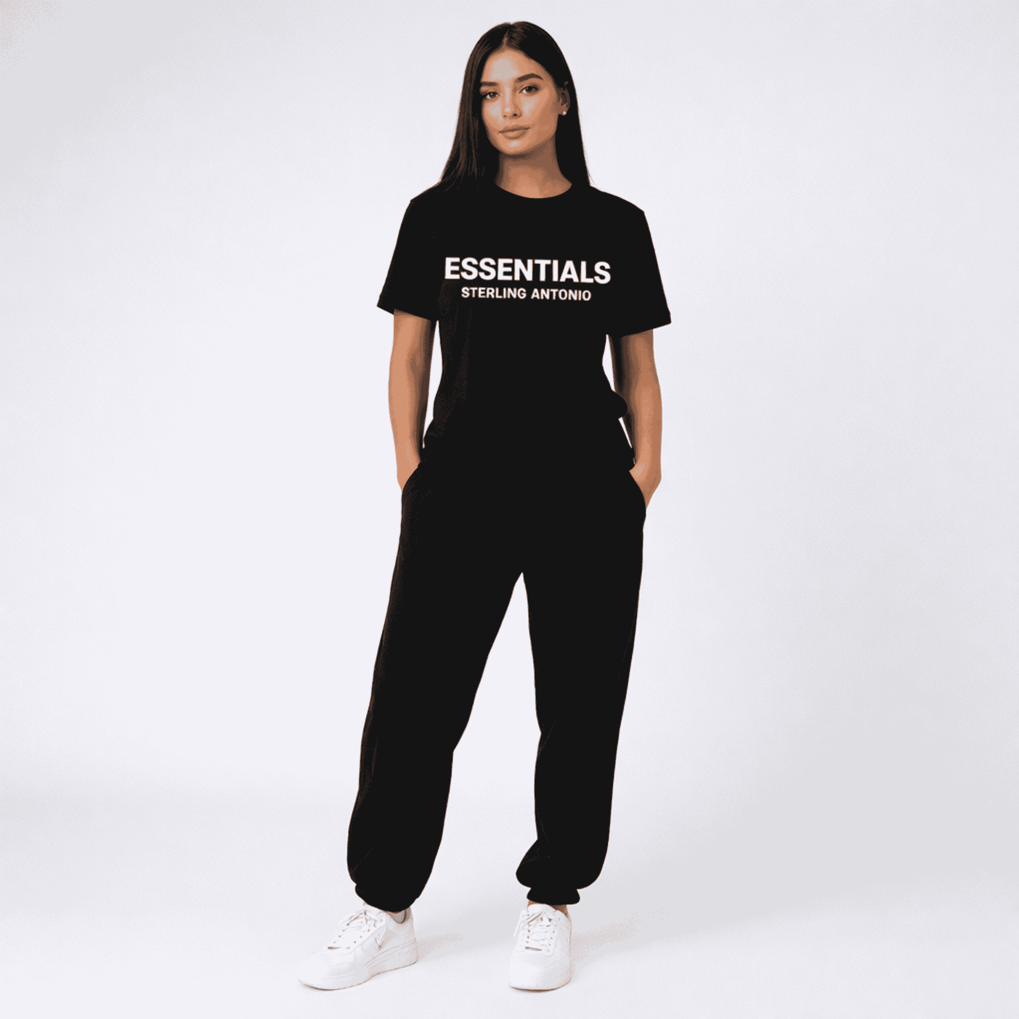 Person wearing a black 'ESSENTIALS STERLING ANTONIO' t-shirt and black pants on a white background
