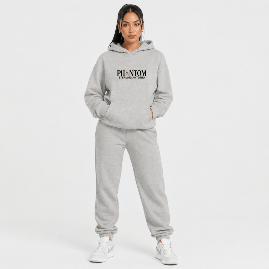 Person wearing a gray hoodie and pants with 'PHANTOM' branding on a white background