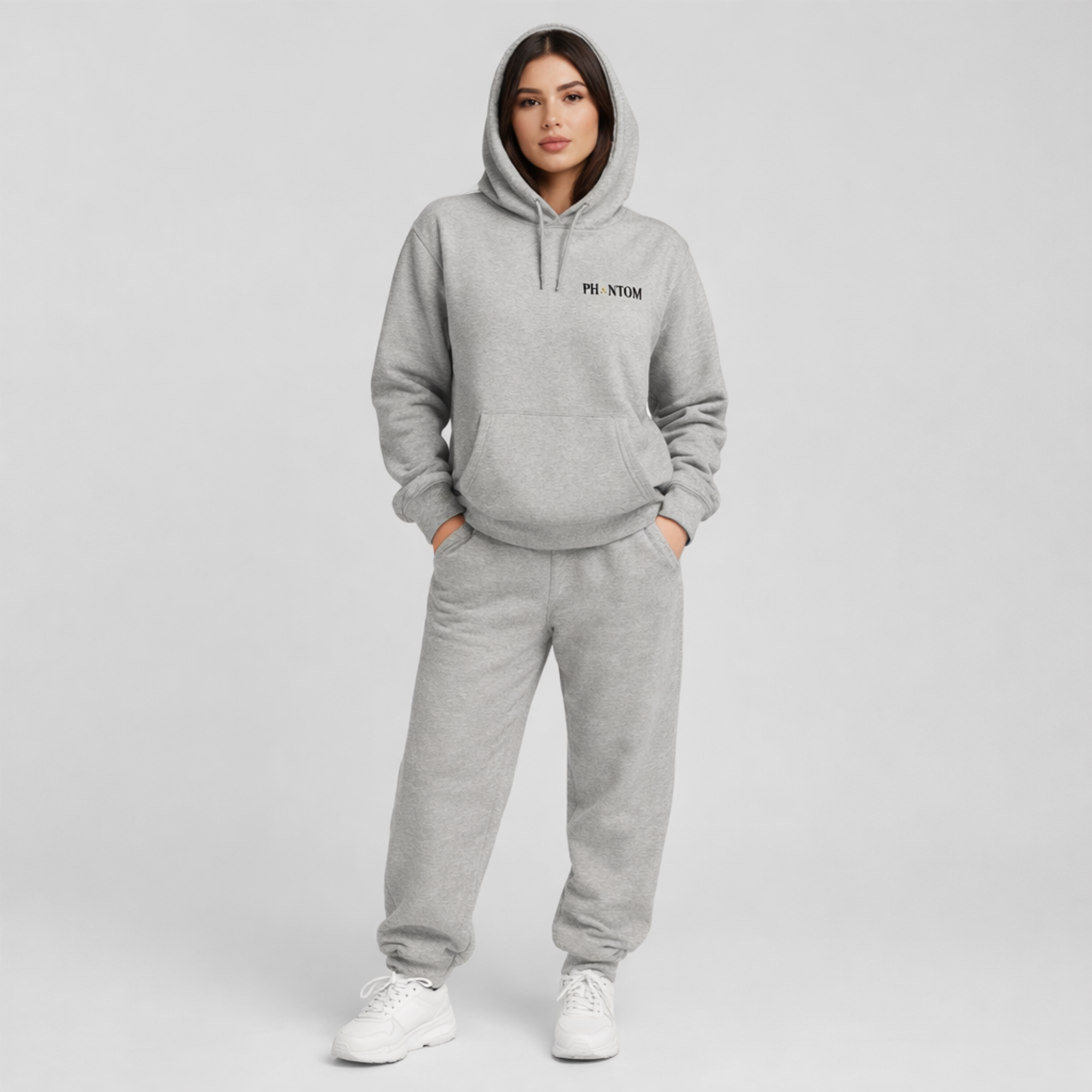 Person wearing a gray hoodie and sweatpants set with 'PHANTOM' branding on a light gray background