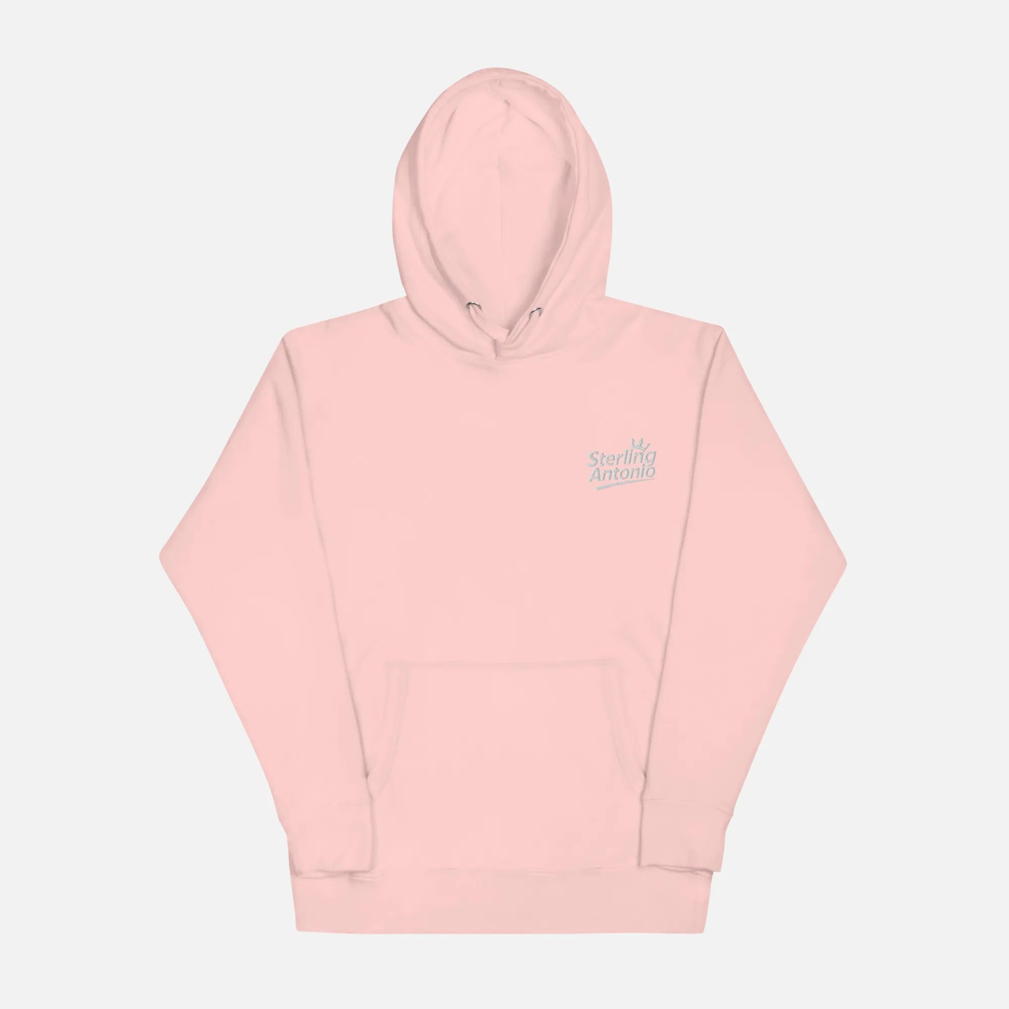 Pink hoodie with a small logo on a light gray background