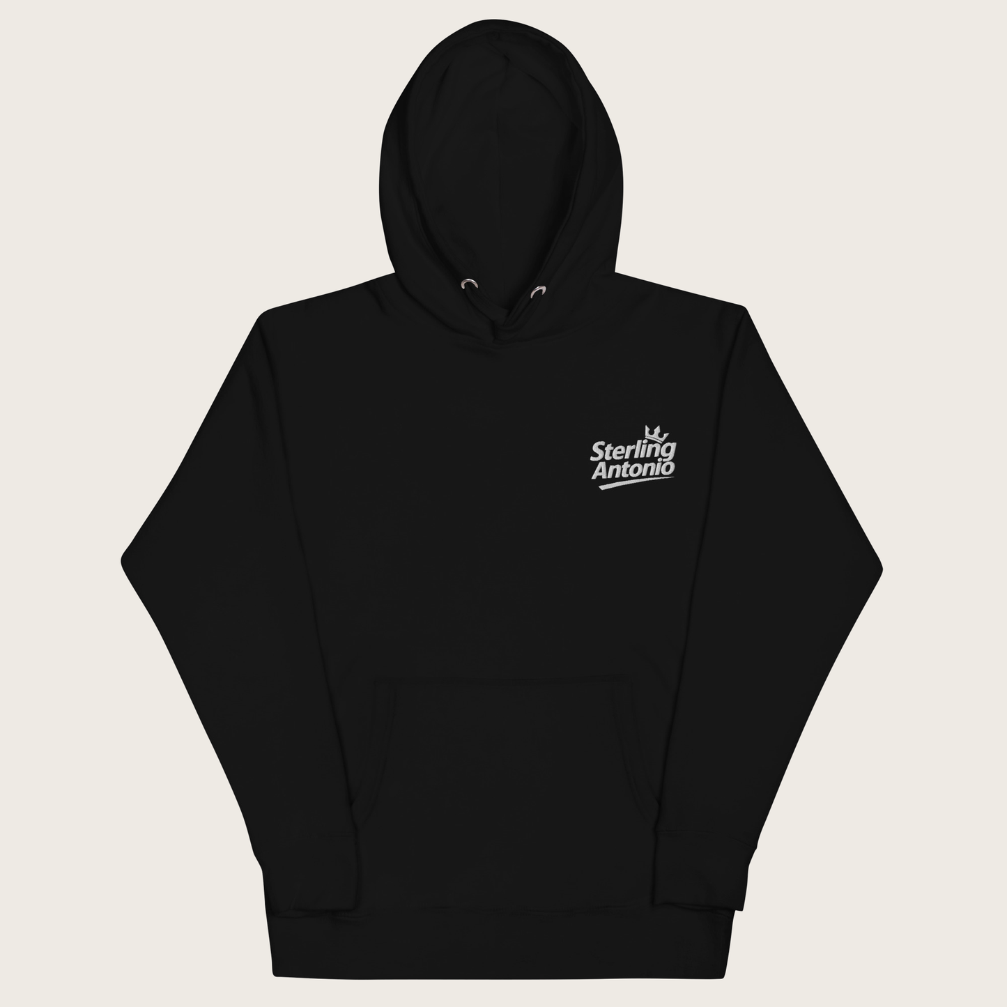 A black pullover hoodie with a small white 'Sterling Antonio' logo printed on the left chest, displayed against a light beige background.