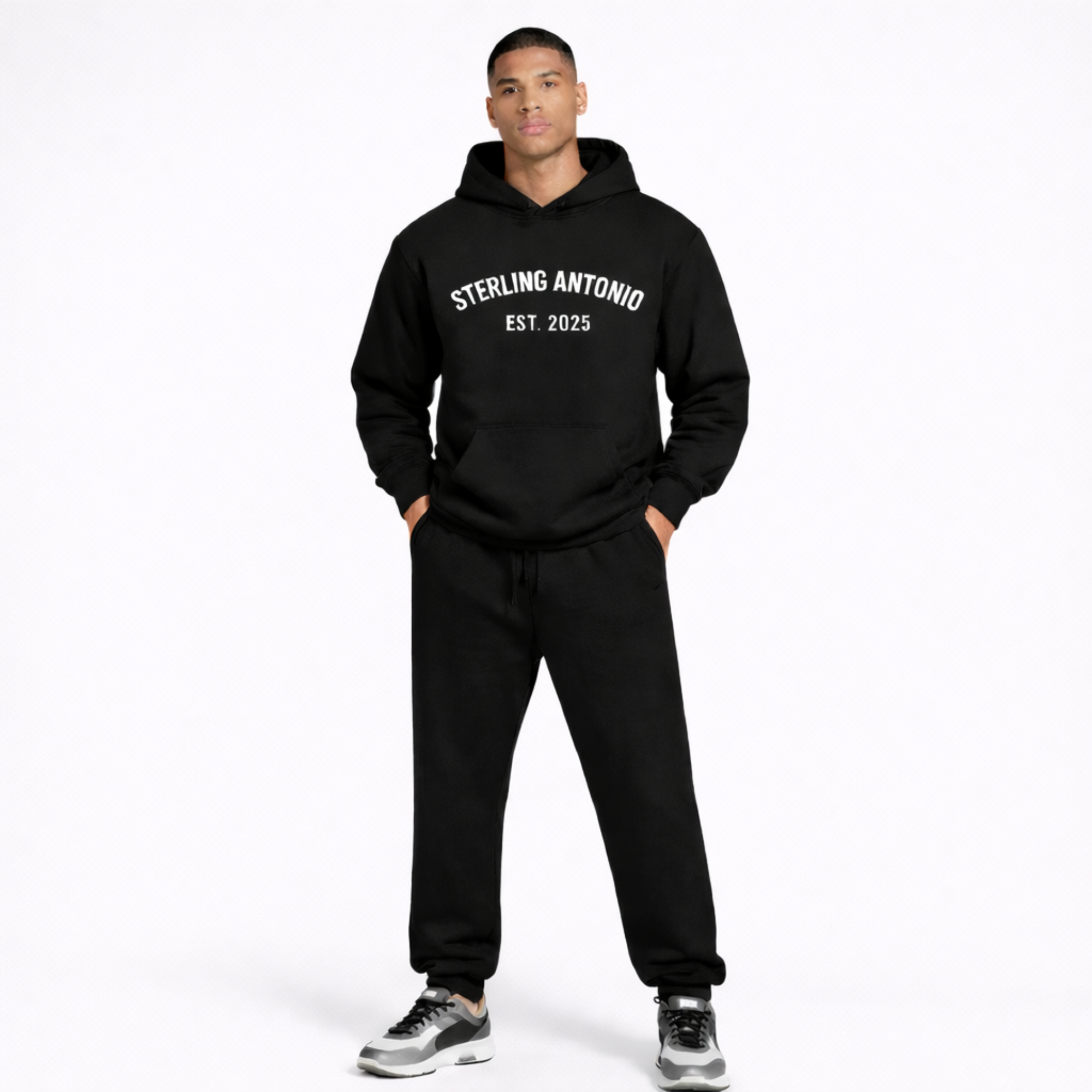 Person wearing a black hoodie and pants with 'Sterling Antonio Est. 2025' text on a white background