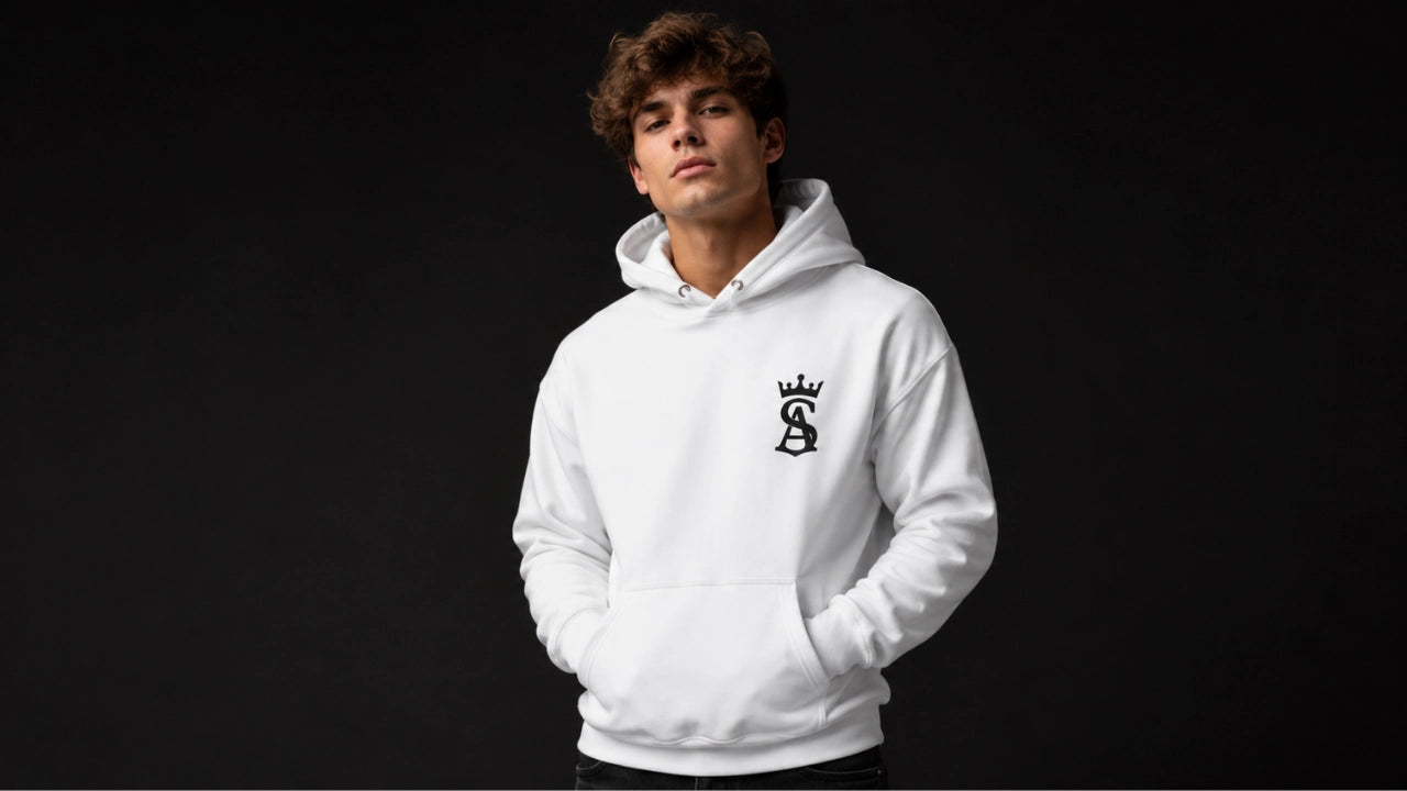 Person wearing a white hoodie with a logo on a black background