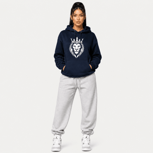 Person wearing a navy hoodie with a lion emblem on a white background