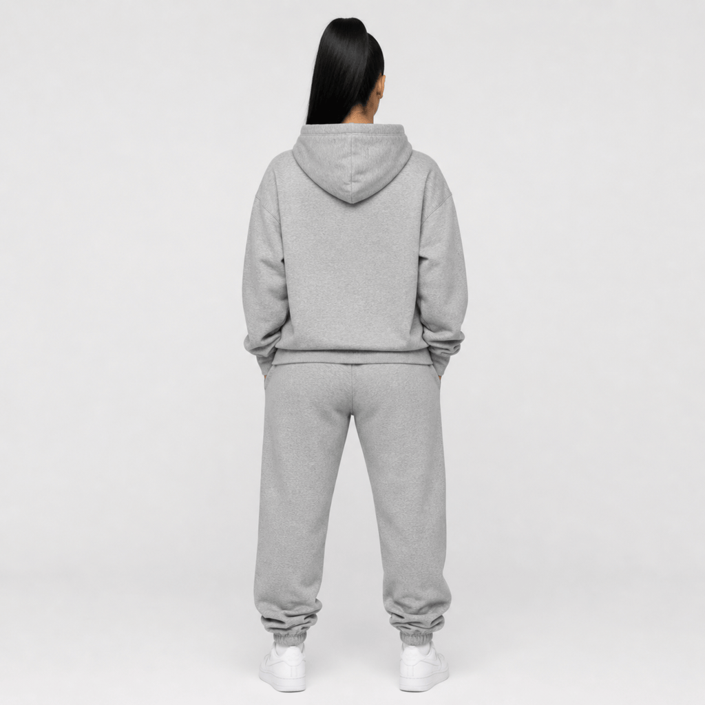 rear view of a person wearing a gray hoodie with a black lion with a crown 