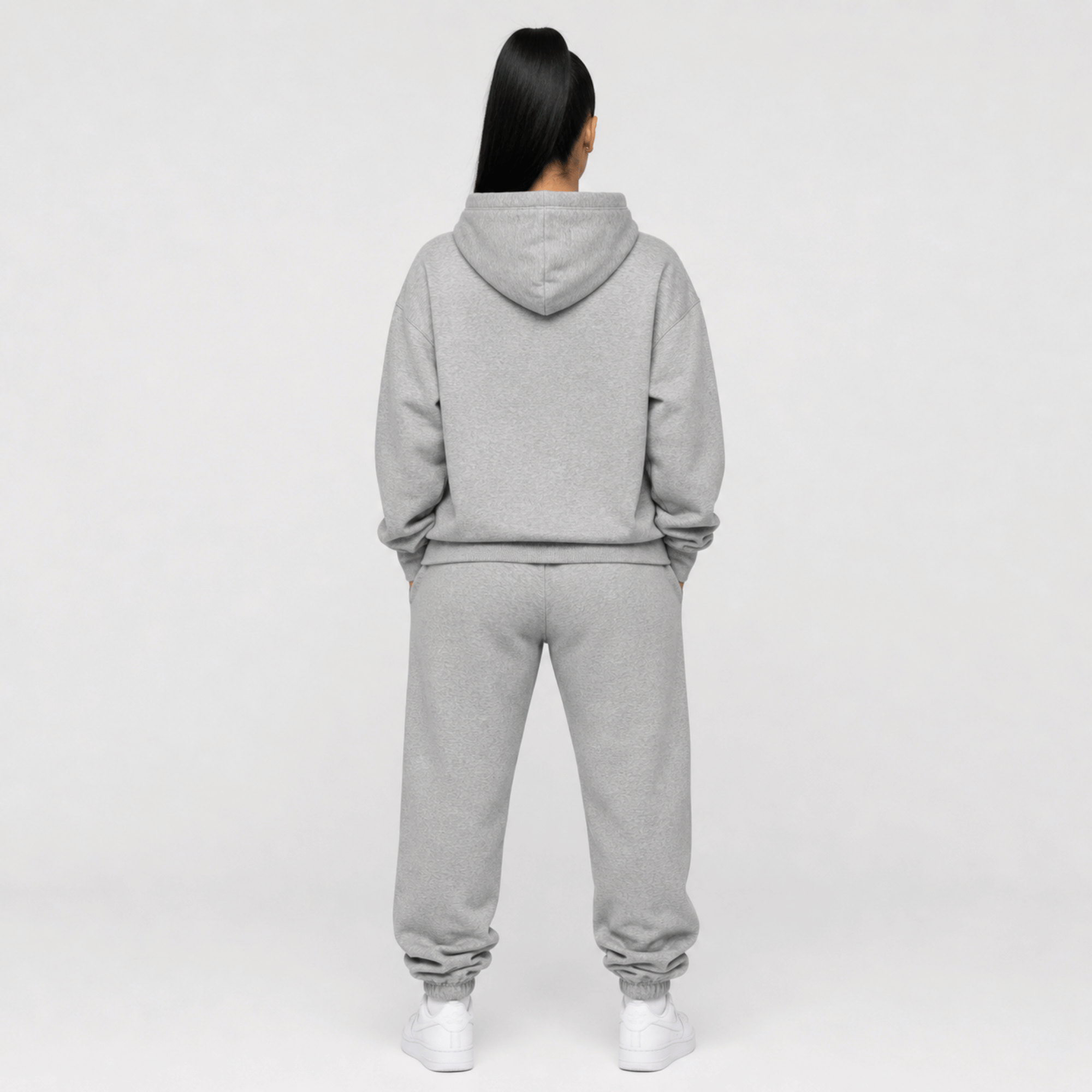 rear view of a person wearing a gray hoodie with a black lion with a crown 