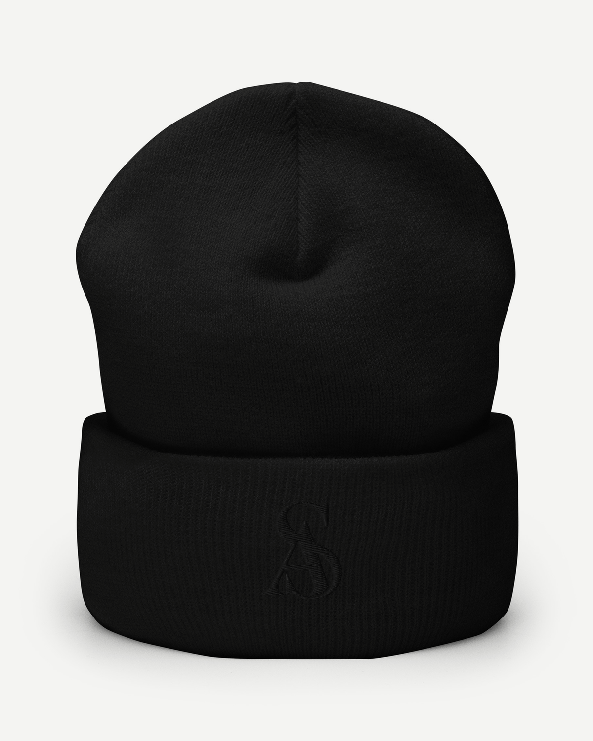 The Black Label Beanie, front view. Black cuffed knit beanie with a tonal SA monogram embroidered on the cuff.