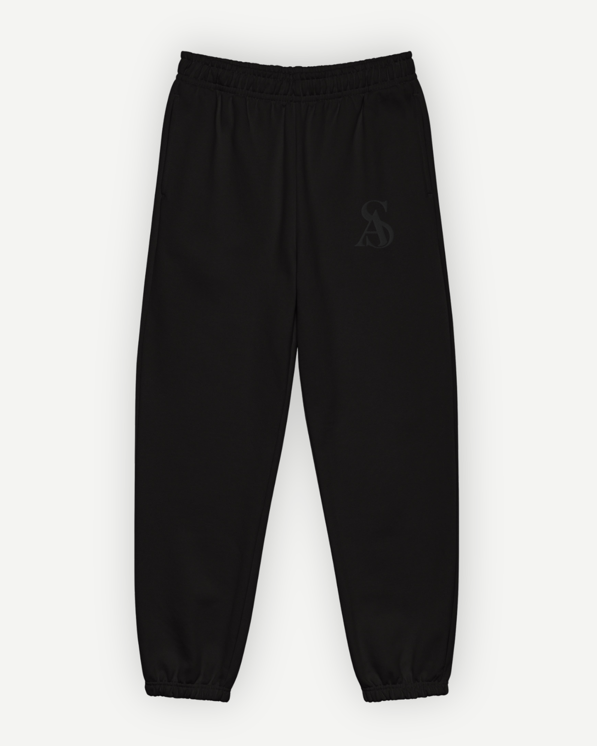 The Black Label Sweatpant in black, front view, with tonal SA monogram embroidered at the left thigh. Sterling Antonio